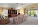 Comfortable living room featuring plush seating, a vaulted ceiling, and sliding glass doors to the outdoor area at 2360 Unity Ter, The Villages, FL 32162