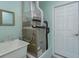 A utility room with a sink, HVAC equipment, and access to the outside at 26315 Newcombe Cir, Leesburg, FL 34748