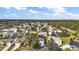 Aerial view of home in a beautiful community; lovely treed neighborhood with well-kept lawns at 273 Pomaria Pl, The Villages, FL 32162