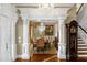 Elegant dining room featuring decorative columns, chandelier, and hardwood floors at 27852 Lake Jem Rd, Mount Dora, FL 32757