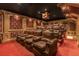 Spacious home theater featuring multiple rows of leather recliners for an ultimate viewing experience at 27852 Lake Jem Rd, Mount Dora, FL 32757