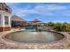 A tanning ledge and water feature highlights this gorgeous backyard pool at 27852 Lake Jem Rd, Mount Dora, FL 32757