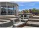 Unique water feature with tiered fountains, brick accents, and views of the outdoor entertainment area at 27852 Lake Jem Rd, Mount Dora, FL 32757