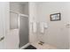 Bathroom features a shower with sliding glass doors and a towel rack at 3009 Batally Ct, The Villages, FL 32162