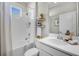 Clean bathroom with tiled shower and tub, stylish fixtures, and modern vanity at 3009 High Pointe St, Clermont, FL 34711