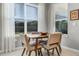 Cozy dining area with natural light and contemporary decor at 3009 High Pointe St, Clermont, FL 34711