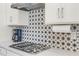 Close up of kitchen featuring stainless steel appliances and decorative backsplash at 3009 High Pointe St, Clermont, FL 34711