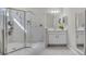 Bright bathroom featuring a glass-enclosed shower and neutral tones at 3009 High Pointe St, Clermont, FL 34711