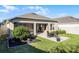 Enjoy outdoor living on this lovely patio with an outdoor fireplace and screened in lanai at 3009 High Pointe St, Clermont, FL 34711