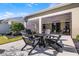 Enjoy outdoor living on this lovely patio with an outdoor fireplace and screened in lanai at 3009 High Pointe St, Clermont, FL 34711