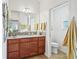 Bathroom featuring wood cabinet with granite countertop and tile flooring at 3047 Bevill Ln, The Villages, FL 32163