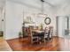 Dining room with wood floors and modern chandelier and decor at 3047 Bevill Ln, The Villages, FL 32163