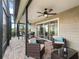 Spacious screened patio perfect for outdoor living with comfortable seating and outdoor dining at 3047 Bevill Ln, The Villages, FL 32163