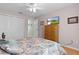 Comfortable bedroom featuring a floral bedspread and plenty of natural light at 3056 Saint Thomas Ln, The Villages, FL 32162