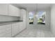 Eat-in kitchen features ample cabinet space and a bright, inviting space with lots of natural light at 3056 Saint Thomas Ln, The Villages, FL 32162
