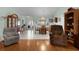 Inviting living room with a formal dining area featuring tile floors and comfortable seating at 3056 Saint Thomas Ln, The Villages, FL 32162