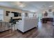 Open living room featuring hardwood floors, neutral paint, modern furnishings, and lots of natural light at 3142 Islawild Way, The Villages, FL 32163