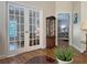 Versatile bonus room with glass paneled french doors and views to the sitting room and bedroom at 3285 Archer Ave, The Villages, FL 32162