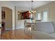 The dining room offers natural light and a view of the kitchen creating an open, welcoming space for dining at 3285 Archer Ave, The Villages, FL 32162