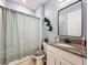 Bathroom featuring a granite countertop and a bathtub, designed for both functionality and style at 3449 Meadow Beauty Way, Clermont, FL 34714