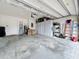 Clean garage with storage options, shelving, and ladders at 3449 Meadow Beauty Way, Clermont, FL 34714