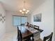 Dining room with chandelier and views to kitchen at 3720 Eversholt St, Clermont, FL 34711