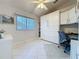 Bright office space featuring tile floors, a Murphy bed, built-in shelves, and a dedicated workspace at 3720 Eversholt St, Clermont, FL 34711