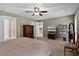 Large main bedroom with carpet, ceiling fan, furniture, and walk-in closet at 377 Ed Douglas Rd, Groveland, FL 34736