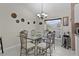 Dining room features a glass table and tiled floors at 377 Ed Douglas Rd, Groveland, FL 34736