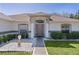 Inviting front entrance with decorative landscaping and neutral color scheme at 377 Ed Douglas Rd, Groveland, FL 34736