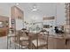 Modern kitchen with granite countertops and seating at the breakfast bar with stainless steel appliances at 377 Ed Douglas Rd, Groveland, FL 34736