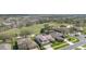 Panoramic aerial shot showcasing a neighborhood near a golf course with well-maintained landscaping at 4256 Fawn Meadows Cir, Clermont, FL 34711