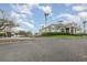 Street-level view of clubhouse and community golf carts at 4256 Fawn Meadows Cir, Clermont, FL 34711