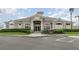 Exterior front view of the community clubhouse featuring a welcoming entrance and well-manicured landscaping at 4256 Fawn Meadows Cir, Clermont, FL 34711