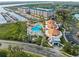 Aerial view of community pool, jacuzzi, pool house and boat slips at 4620 Riverwalk Village Ct # 7505, Ponce Inlet, FL 32127