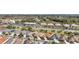 Neighborhood view showcasing homes near shops and restaurants, providing convenient access to amenities and services at 483 Cammarano Pl, The Villages, FL 32162