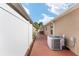 Exterior view of the side yard, featuring well-maintained landscaping and privacy fencing at 483 Cammarano Pl, The Villages, FL 32162