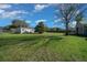 Large backyard featuring a shed, mature landscaping, and plenty of green space at 4940 County Road 134B, Wildwood, FL 34785