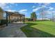 Expansive backyard featuring a patio, gazebo, and well-maintained lawn perfect for outdoor activities and relaxation at 4940 County Road 134B, Wildwood, FL 34785