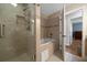 Modern shower with a glass door, rainfall shower head, and a soaking tub at 4940 County Road 134B, Wildwood, FL 34785