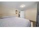 Cozy bedroom with wood floors and a view to another room at 4940 County Road 134B, Wildwood, FL 34785