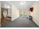 Versatile bonus room with carpet, French doors to yard, and access to bedroom at 4940 County Road 134B, Wildwood, FL 34785