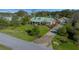 Charming home featuring a long driveway, well-manicured lawn and mature landscaping at 4940 County Road 134B, Wildwood, FL 34785