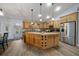 Beautiful kitchen with custom cabinets, granite countertops, and stainless steel appliances at 4940 County Road 134B, Wildwood, FL 34785