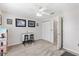 Bedroom with a ceiling fan, closet, and two chairs at 4982 Ne 124Th Rd, Oxford, FL 34484