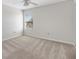 Bedroom with a window and neutral carpeting at 4982 Ne 124Th Rd, Oxford, FL 34484