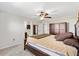 Spacious primary bedroom featuring a fan and ample closet space at 4982 Ne 124Th Rd, Oxford, FL 34484