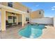 Backyard view of a beautiful pool and spa with a covered patio and outdoor seating at 4982 Ne 124Th Rd, Oxford, FL 34484