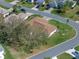 An aerial perspective highlights the home's well-maintained roof, set within the serene landscape at 5533 Squires Dr, Leesburg, FL 34748