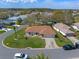 An aerial view showcases the home's landscaping, curb appeal, and its location within the community at 5533 Squires Dr, Leesburg, FL 34748